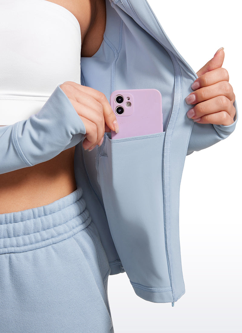 CRZ YOGA Jaket Hoodie Wanita dengan Ritsleting Penuh, Potongan Slim Fit, Kantong, dan Motif " Butterluxe " dalam Warna Biru Cambric